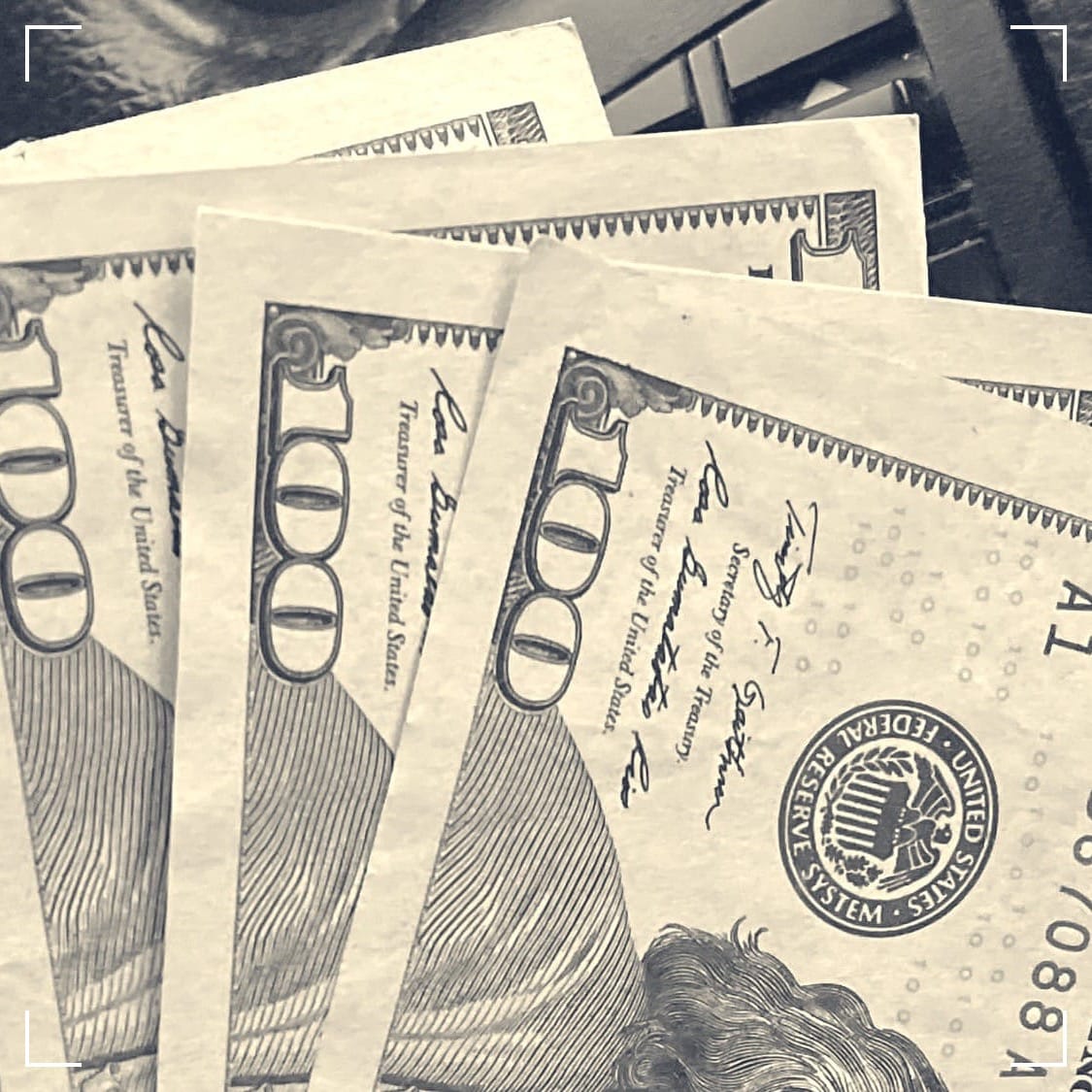 Five $100 bills